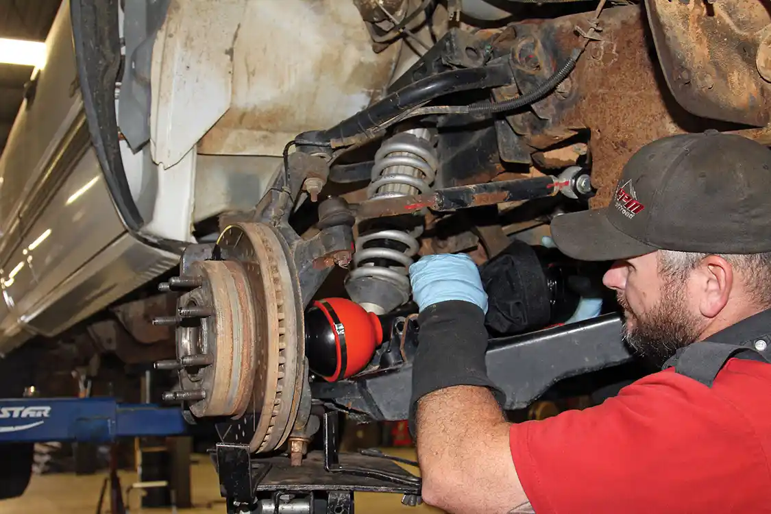 25. Nelson then installs the RCV axle assemblies on each side of the truck using anti-seize coating on the splines at the drive flanges.