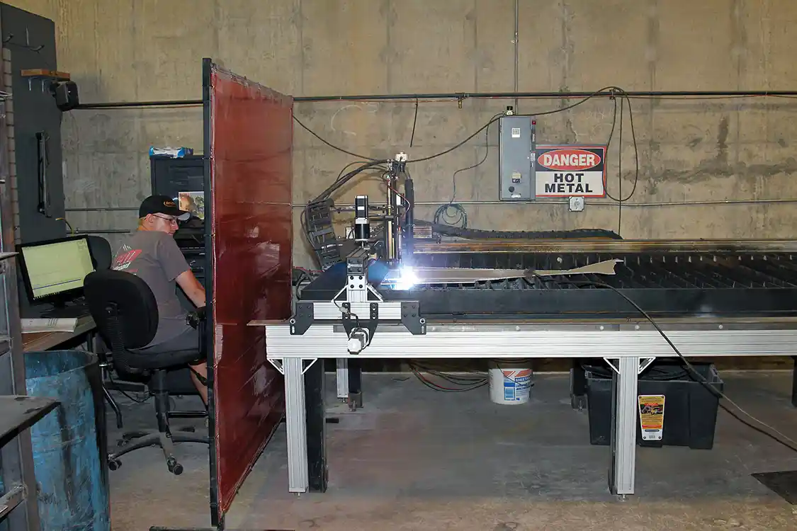 32. Charlie Holbrook programs RPM’s Torchmate plasma cutting table to cut the aluminum plates used to mount the ARB Twin Air compressor and tank.
