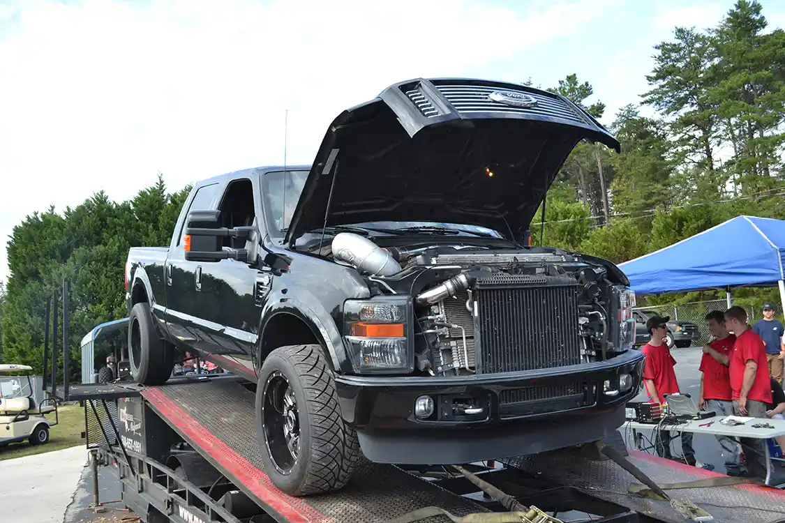 All hell broke loose when Wayne Allan's compound turbo Ford was loaded down, as the 6.4L had a huge screaming <a href="https://www.garrettmotion.com/">Garrett</a> turbo as an atmospheric charger. The black Ford laid down 968rwhp, which was the top number for the event.