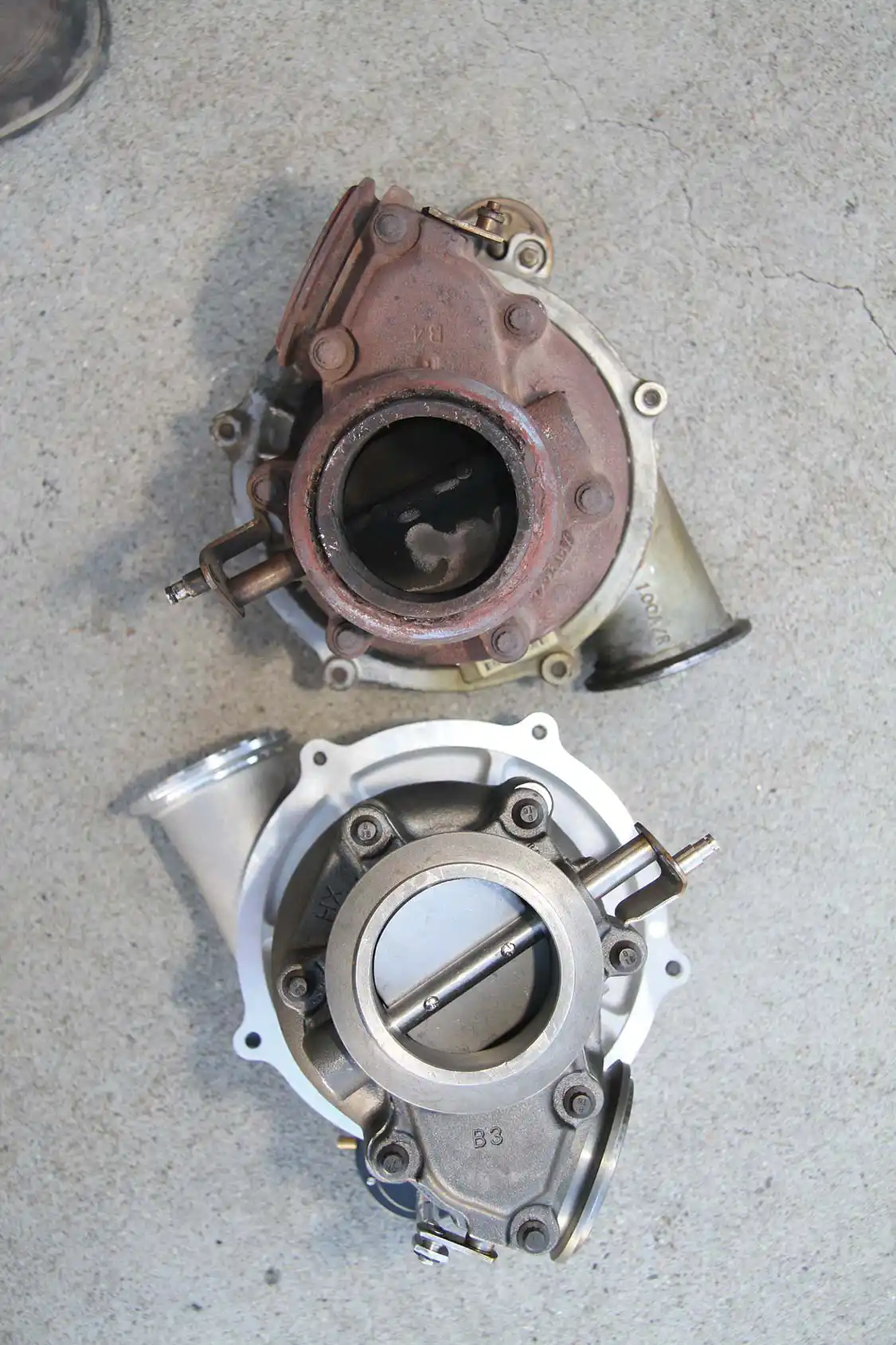 3. This view shows that the two turbos are virtually the same on the exhaust side of the unit. This makes for an easier fitment in the tight space available and the mild upgrade does fine without the added cost and space needs of a larger unit.