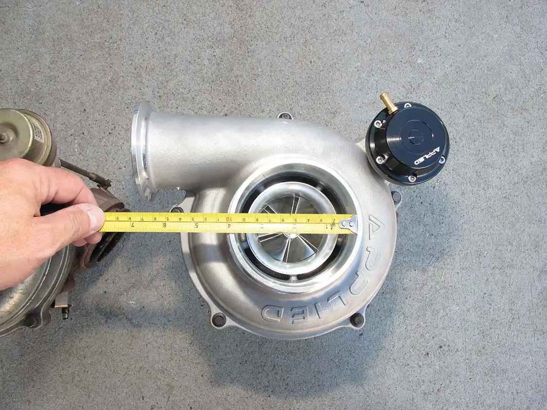 4A/4B. The difference in diameter of the stock (top) and Applied (bottom) intake side of the turbo housing is 2.75 inches vs. 3.75 inches. This results in an area increase of more than 80 percent. More area equals more air volume.