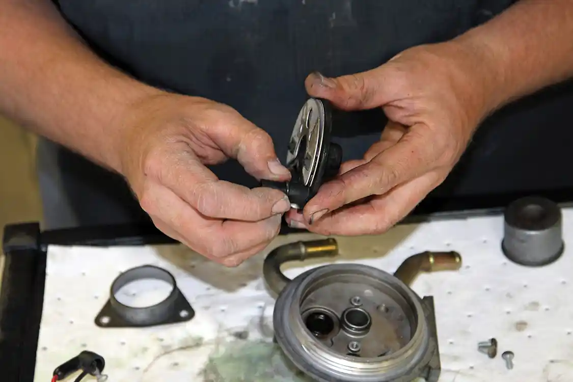 17. The replacement O-rings from the kit are installed next. They must be fully seated and not twisted, and lubricated with a small amount of clean engine oil so they will slide into position during assembly without snagging and getting damaged.