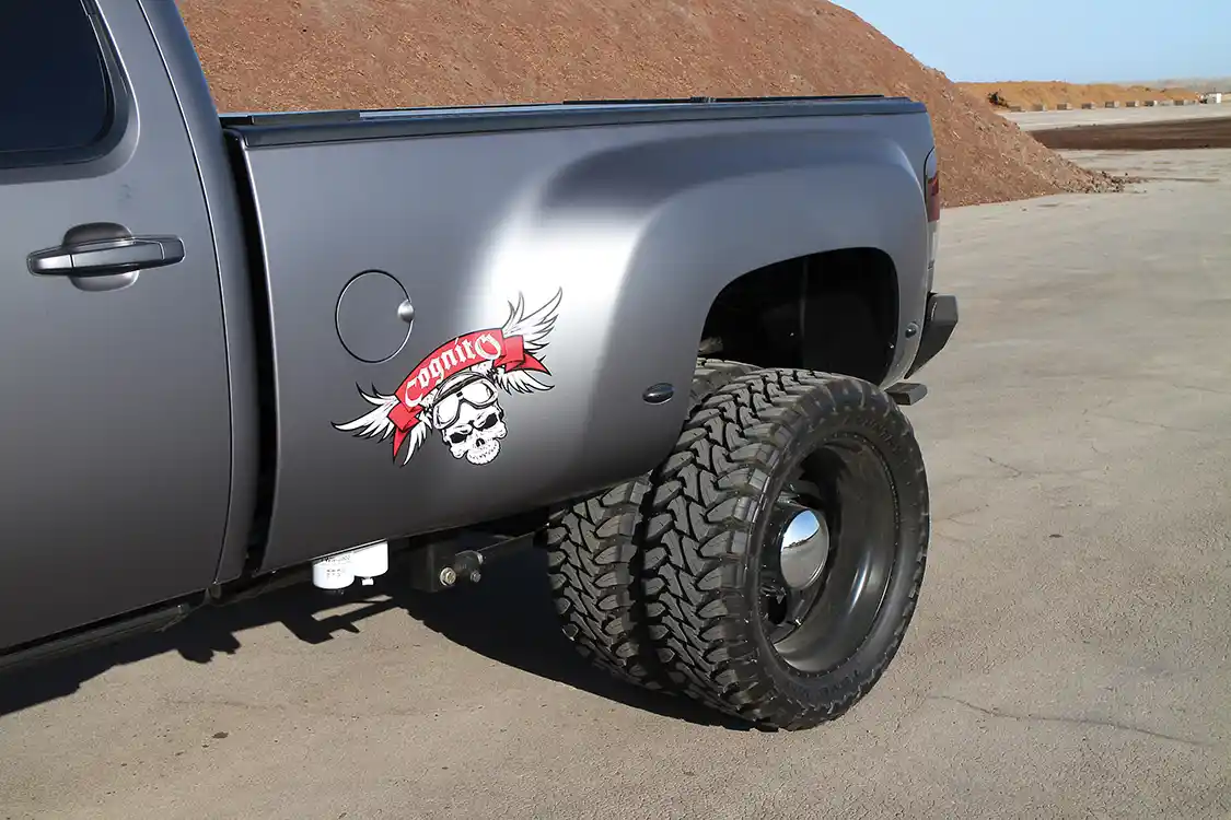 The main emphasis of the build was to convert a Silverado standard bed into a dually. A dually rear differential complete with 3500 series brakes was purchased from the Internet. Four American Force Weapon matte black dually wheels and Toyo Open Country M/T tires contribute to the aggressive off-road appearance.