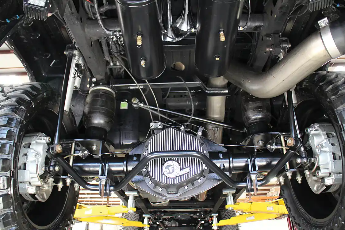 A Kelderman rear four-link suspension is supported and assisted with a pair of pneumatic bags, Fox remote-reservoir shocks, sway bar, longer end links and panhard bar.