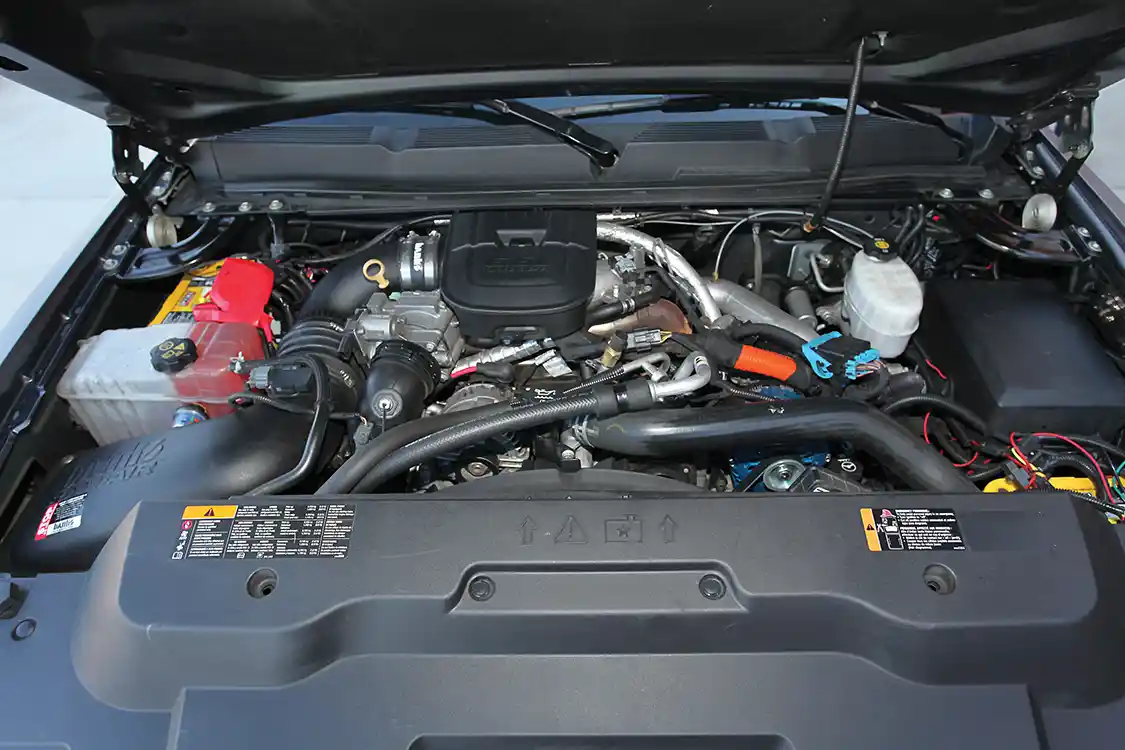 Lifting the hood exposes the mighty Duramax 6.6L turbo diesel that’s equipped with a <a href="https://www.bankspower.com/">Banks</a> cold air intake and tuned by an <a href="https://hs-motorsports.com/">H&amp;S</a> Mini Maxx programmer.