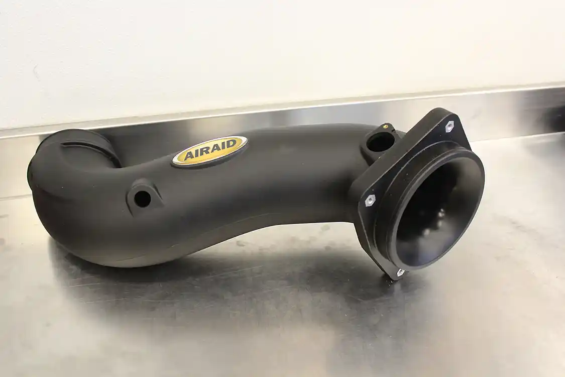 7. Some thought obviously went into the new AIRAID intake tube. Not only does it include provisions for all of the factory sensors and such, it incorporates a velocity stack into the filter mount that optimizes airflow similar to the venturis on a carburetor. It also has smooth interior walls rather than the factory accordion-style tube.