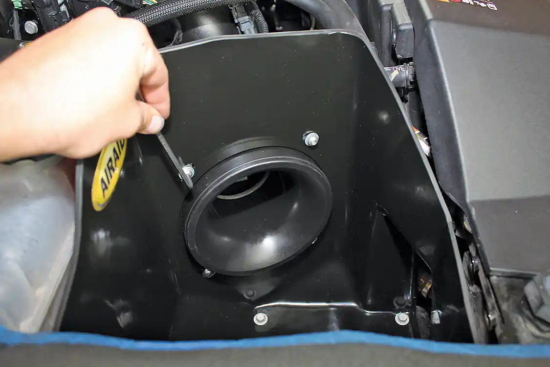 10. The lower portion of the intake tube secures to the MXP air box using four stainless Allen-head bolts. The filter attaches to the intake tube itself, so there’s no need for another coupler at the intake box.