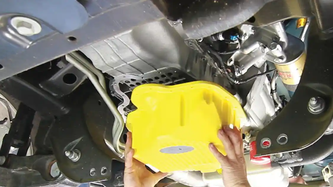 10. A bead of new OEM sealant is applied to the Banana Pan mounting surface and the pan is then installed. It then must be allowed to cure or set undisturbed for at least 24 hours.