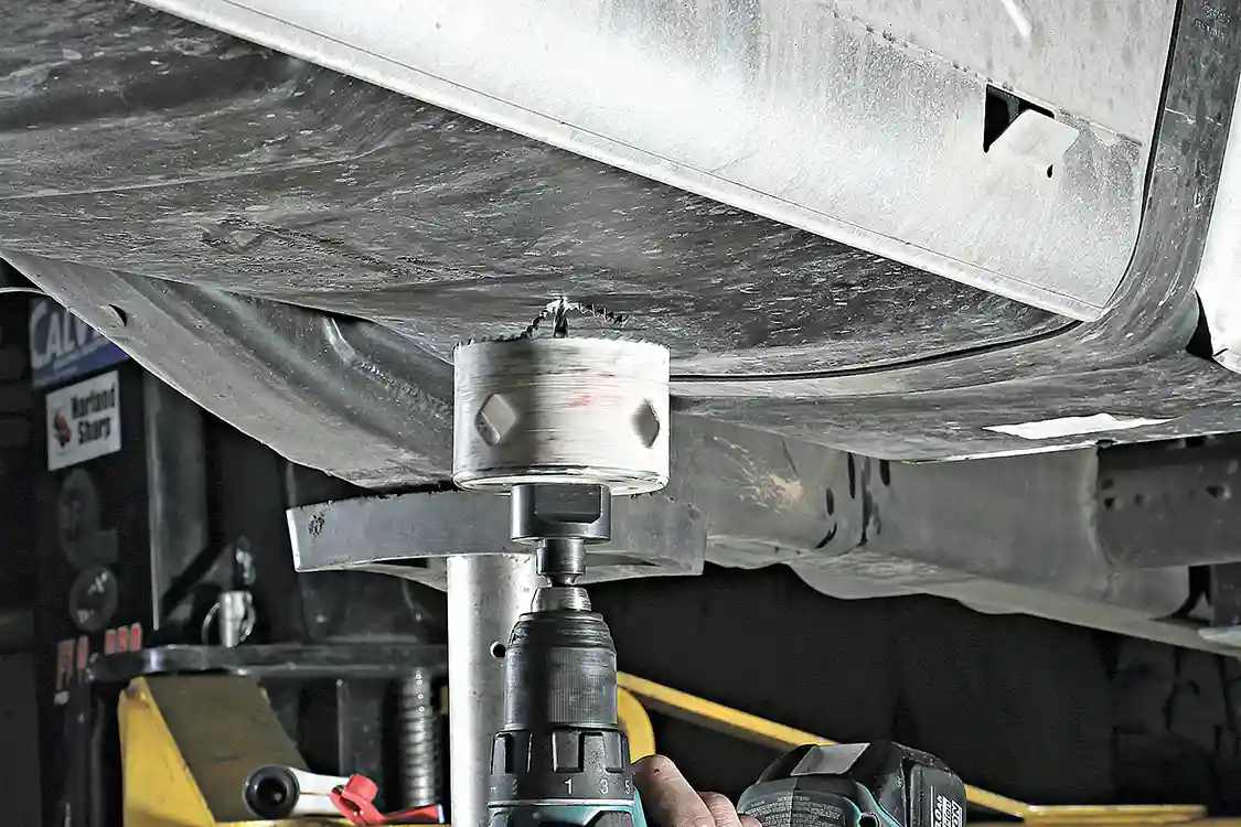 9. Once the Fuelab system is fully installed, the DRP fuel sump kit needs to be mounted in the factory fuel tank, so the pump’s feed line can be connected and start pulling fuel from the tank to feed that hungry Duramax. While it may seem a bit crazy to drill a hole in the bottom of your fuel tank, the DRP sump design will ensure a leak-free seal.