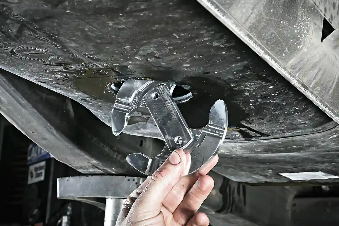 12. The DRP kit comes with a metal in-tank bracket that’s slid inside the fuel tank with the beveled side facing up. The sump is bolted to this mounting bracket for a tight, leak-free seal.