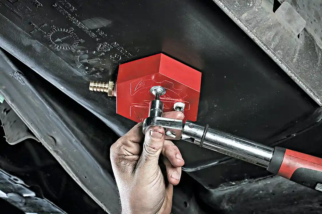 13. Next, install the two supplied bolts through the bottom side of the fuel sump and thread them into the previously installed in-tank bracket. These bolts will then need to be torqued to 13 ft.-lb. These torque specs are crucial to a leak-free and lasting seal.