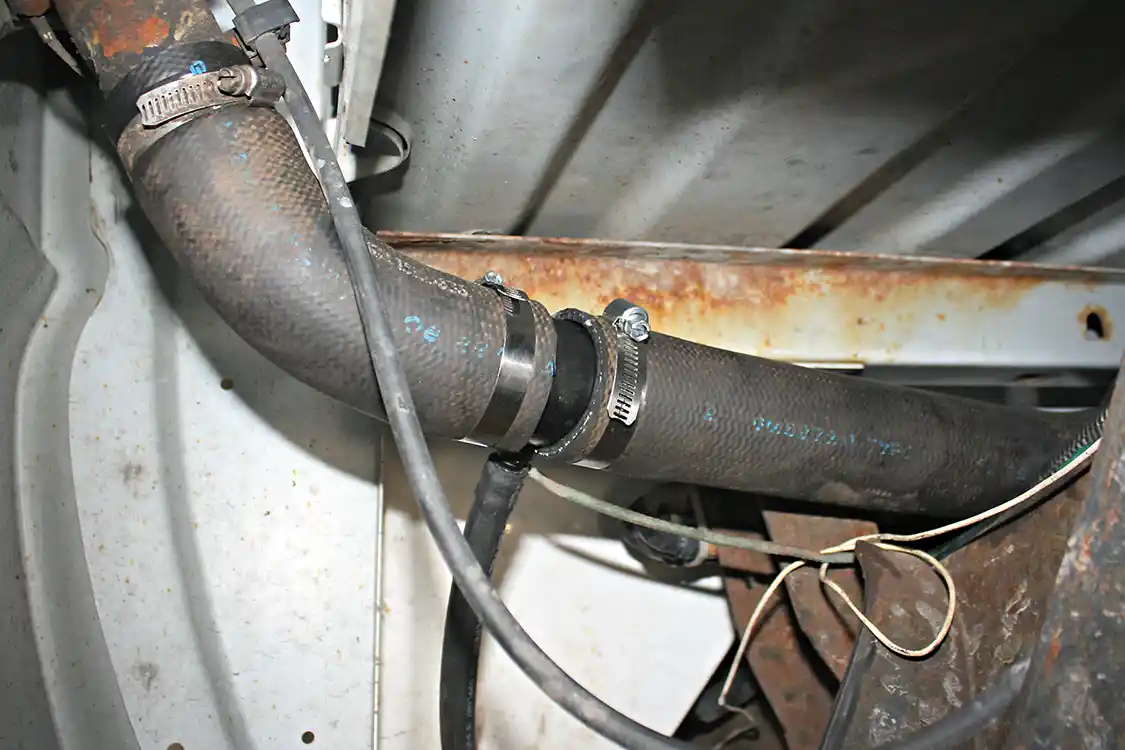 7. The Fuelab Prodigy pump provides more fuel than what can be used by the engine. The system is designed so any unused fuel and air that are separated inside the Fuelab Vortex is sent through a small hose back to the truck’s fuel fill neck. The Duramax installation kit included a powder-coated steel pipe insert that’s spliced in line with the fill neck hose to ensure a leak-free installation.