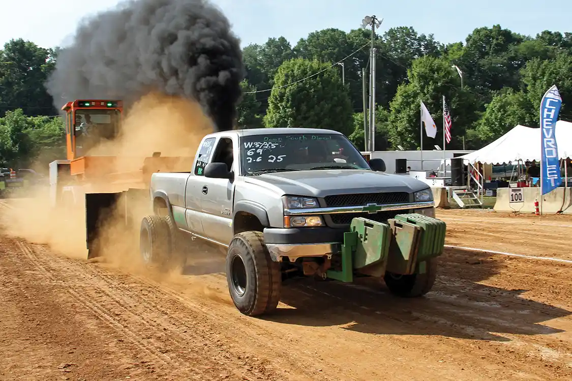 Hank Carlton used his Chevy to take home the win and the prize money in the Workstock/2.5 class with a pull of nearly 330 ft.