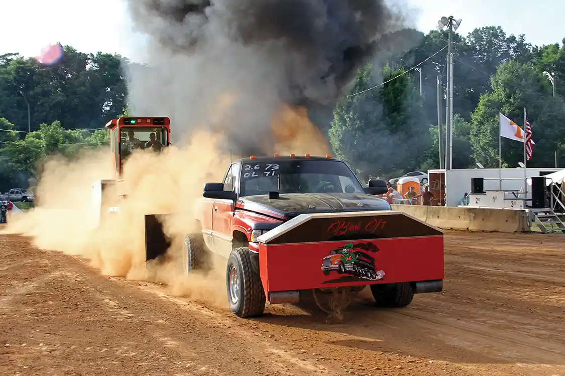 The pulls went very smoothly with very little carnage throughout the day, but this driver found out the hard way that he should have used hose clamps on his ice water hoses connected to the weight box as one popped off and leaked the water onto the track where it doesn't do the engine any good.
