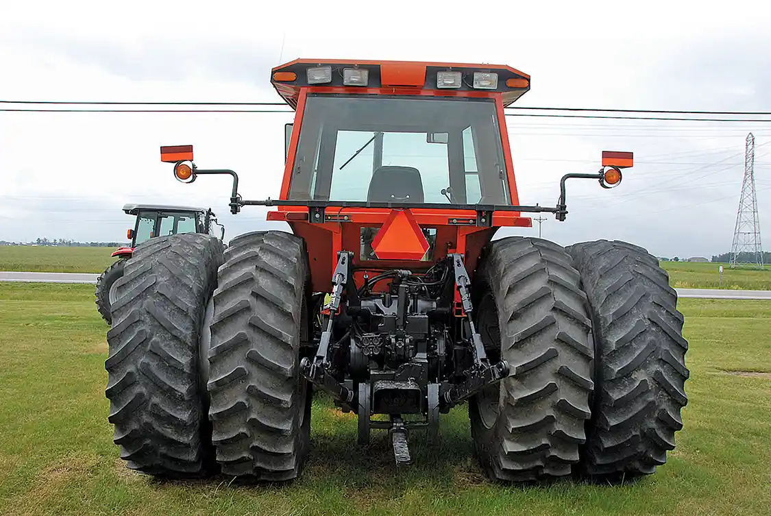 The business end shows the Category II/III three-point hitch, drawbar and dual hydraulic outlets.