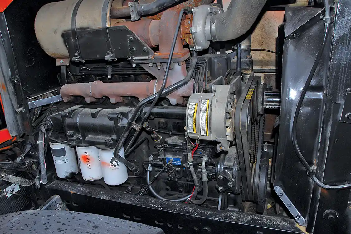 The 670I in the 8070 was a highly evolved diesel at the end of its production run. It was originally developed for the 1963 D21 as the D3400 and underwent many upgrades from there. The first was an upgrade to turbocharging and a new designation, D3500, and a boost in power from 103 to 127 PTO horsepower. The Mark II engines came around 1973 with serious internal and external upgrades to accommodate flywheel power ratings of more than 220 hp. Minor tweaking continued to improve power and durability to the end of tractor production. It was a seven-main bearing, direct-injected engine with wet sleeves. The injection pumps used included Roosa Master, Simms, <a href="https://www.bosch.us/">Bosch</a>, and <a href="https://ambacinternational.com/">AMBAC</a>, the last of which is the pump on this late-model engine.