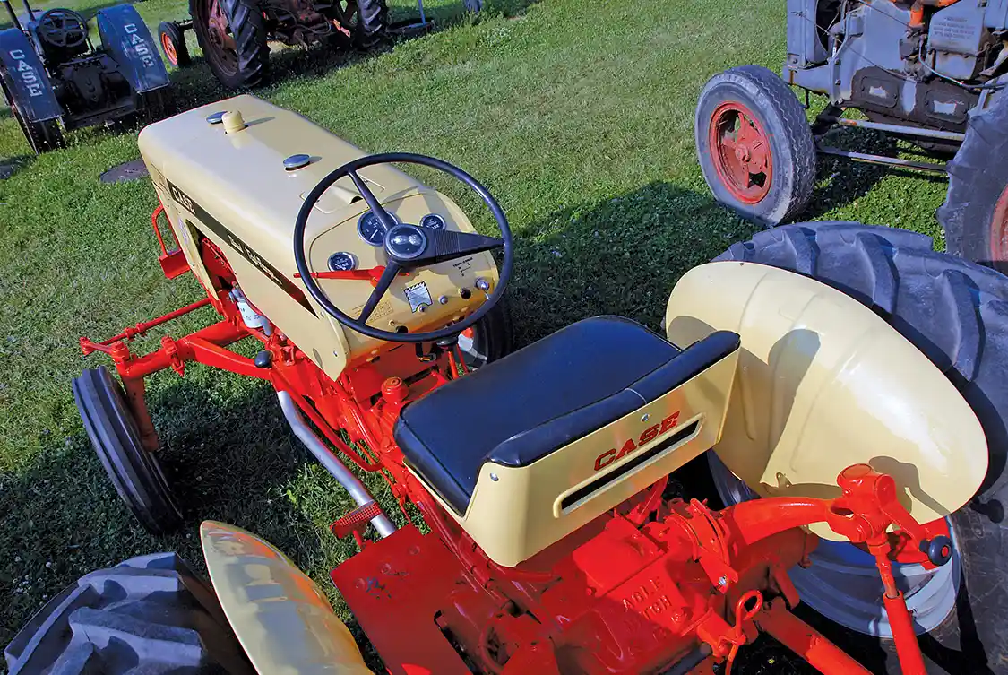 There was nothing particularly impressive about the 430's seating arrangement. The seat was a little better than most but without a substantial back. The controls were well positioned, though. Note the hand clutch, the long lever to the left of the steering wheel. In the rearward position, the transmission was disengaged but the PTO retained power flow. This enables the tractor to be stopped without interrupting power to PTO-driven implements.