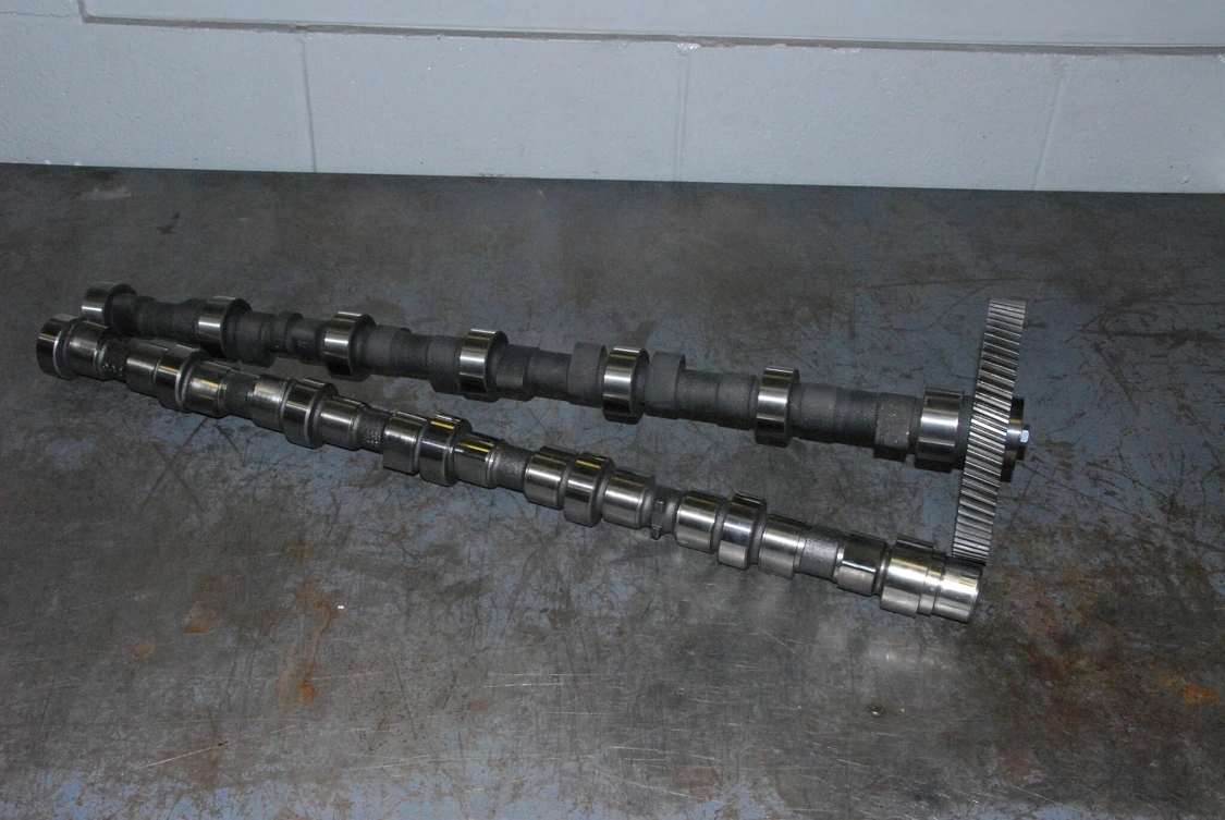 2. Hamilton’s 232-252-105.5 cam is designed for high-revving Cummins engines. The difference in lift and duration are obvious even to the eye. The stock cam has 0.235-inch intake and 0.297-inch exhaust lobe lift. The Hamilton has 0.307 inch of lift. The stock cam has 107.5-inch lobe separation angles (LSA, also LCA for Lobe Center Angles). The Hamilton increases overlap to 105.5°. Intake and exhaust duration are 232° and 252° respectively, compared to 159° and 206° stock. All this adds up to significant improvements in breathing ability, but it does narrow the powerband significantly, moving it up to the 4,000—5,200 rpm range.