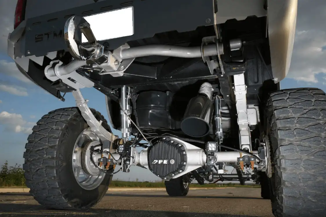 Arched 10-inch springs from <a href="http://atlassuspension.com/index.html">Atlas</a> combined with 2-inch blocks give the truck its 12-inch lift, and <a href="https://www.ridefox.com/">Fox</a> shocks provide 14-inch of travel. A <a href="https://www.ppepower.com/shop/">PPE</a> rear differential cover dresses up the painted axle.
