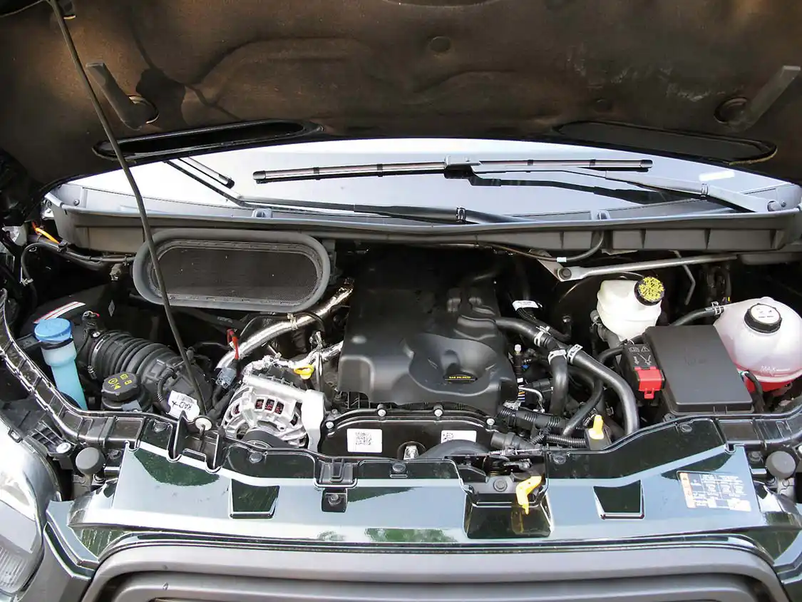 As with most vans, the engine is located deep under the hood. 