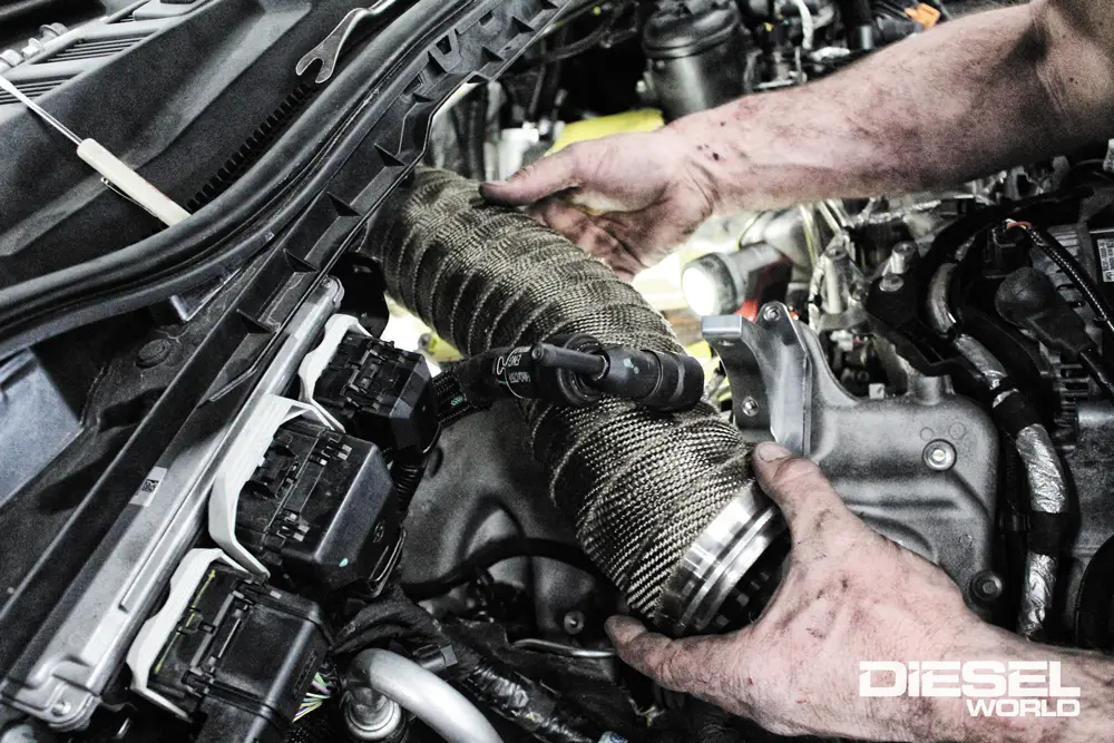 Ford Power Stroke 6.7L 4-inch downpipe treated with DEI titanium exhaust wrap