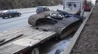 Low-bridge equipment hauling accident